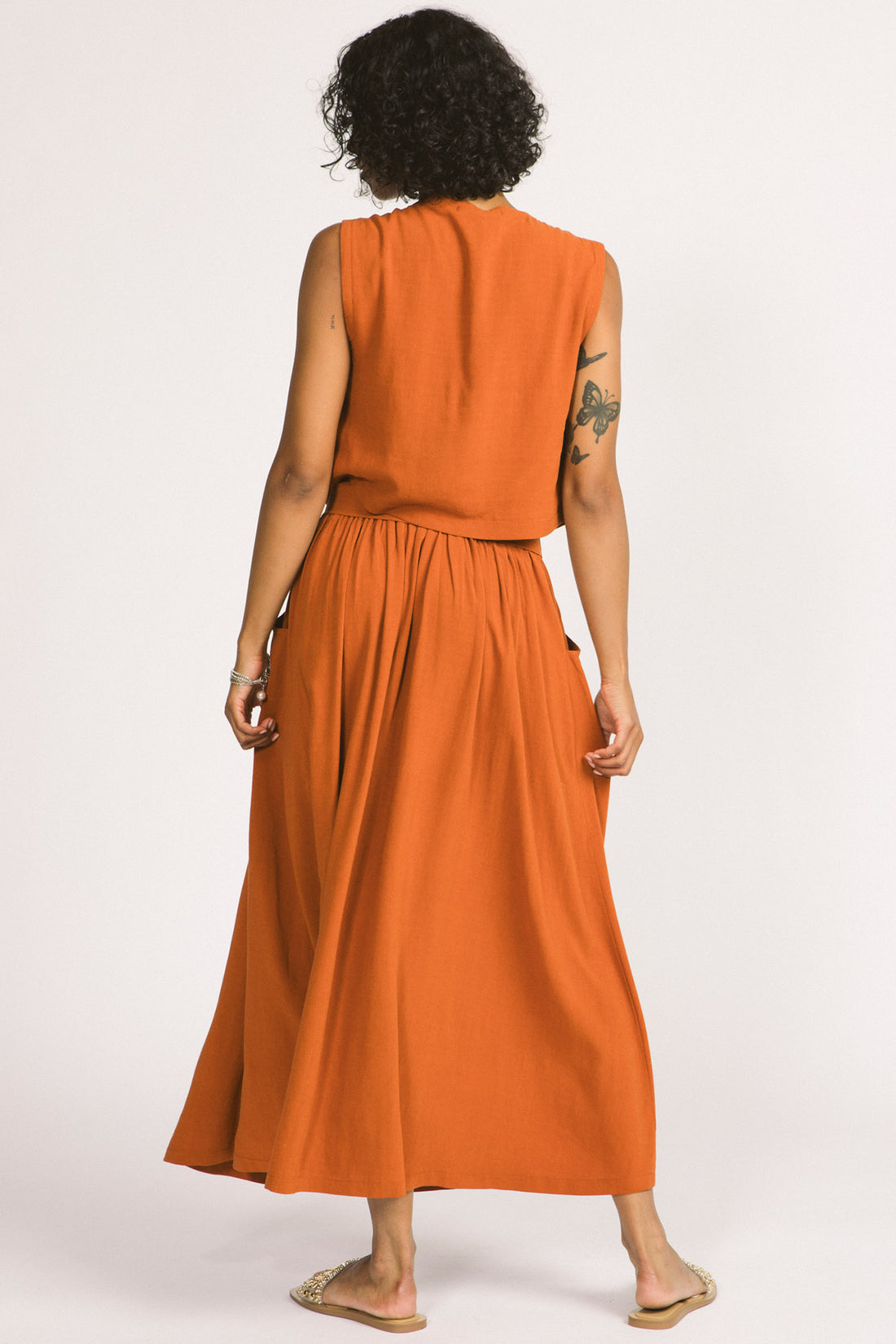 Oriana Skirt by Allison Wonderland, Rust, back view, full maxi skirt, elastic waist, removable belt with beads, pockets, eco-fabric, viscose/linen, sizes 2-12, made in Vancouver
