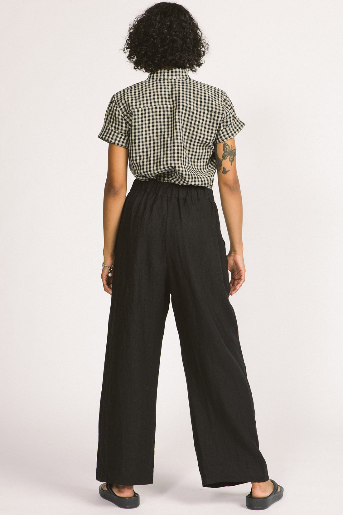 Romy Pants by Allison Wonderland, Black, back view,wide legs, full length, flat waistband with elastic at the side, pleats, pockets, eco-fabric, linen, sizes 2-12, made in Vancouver