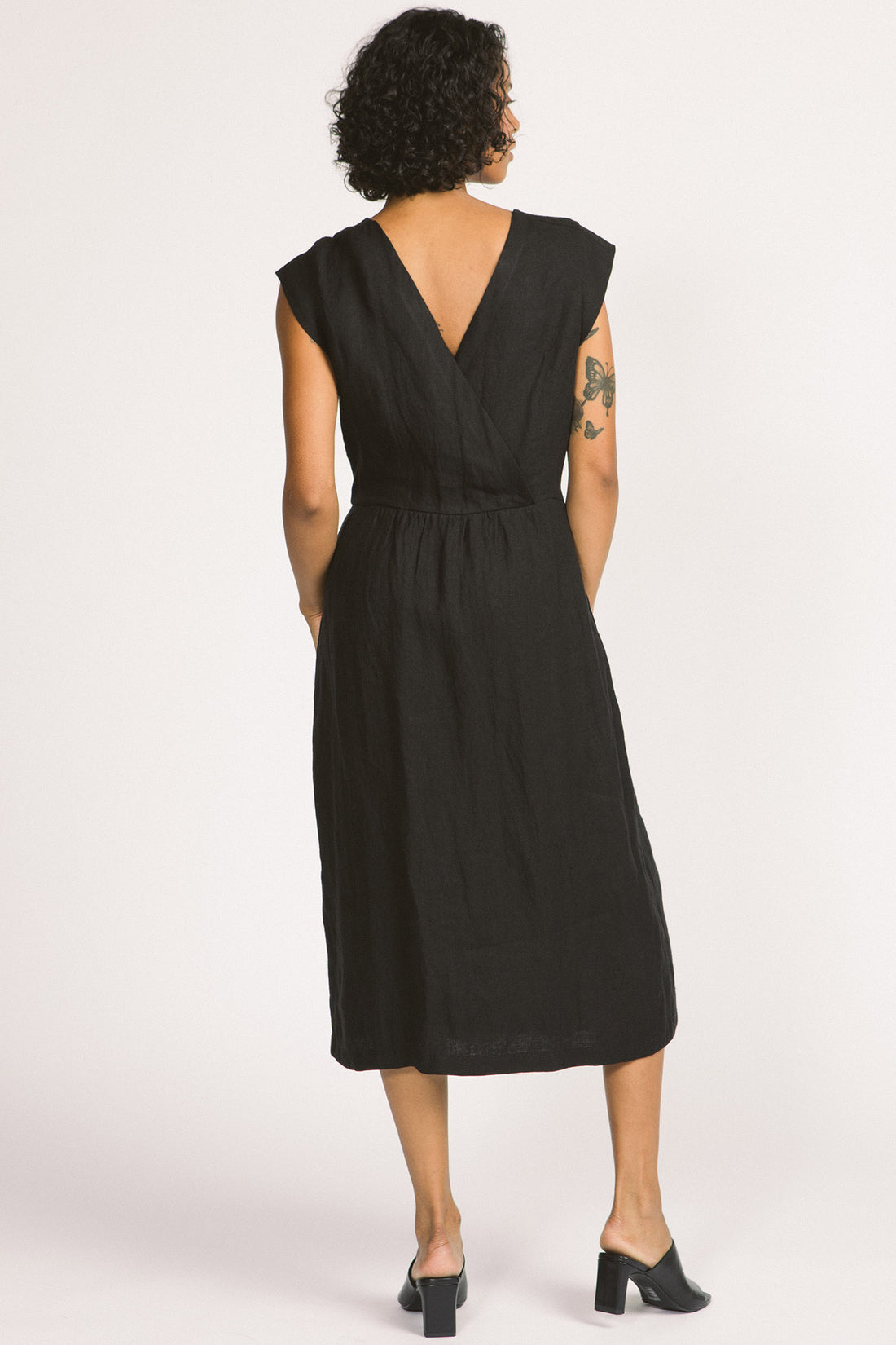 Blythe Dress by Allison Wonderland, Black, back view,  midi-dress, button front, cap sleeves, cross-over back, gathered waist, eco-fabric, linen, sizes 2-12, made in Vancouver