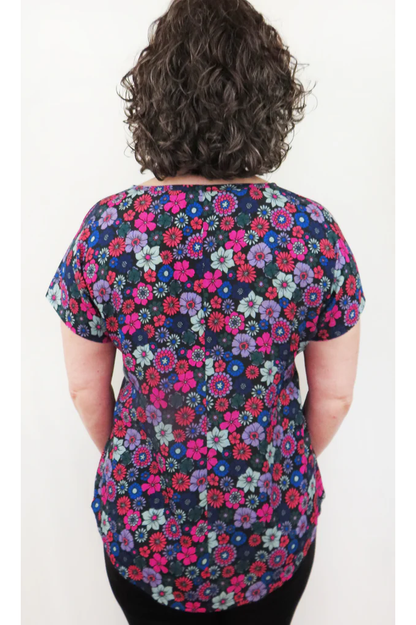  Bea Blouse by Mandala, Vintage Floral Purple, back view, round neck, short sleeves, French darts, scooped hem, pull-on, sizes XS to XL, made in Ontario 