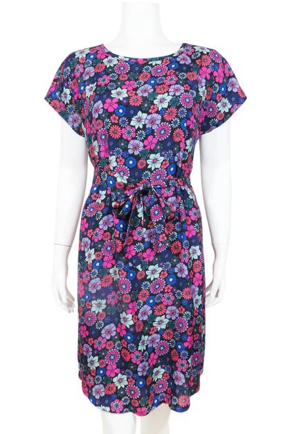 Beatrice Shift Dress by Mandala, Vintage Floral Purple, round neck short sleeves, French darts, elastic at back of waist, tie belt, keyhole cutout at back of neck, pull-on, scooped knee-length hem, pockets, fully lined, sizes XS to XL, made in Ontario