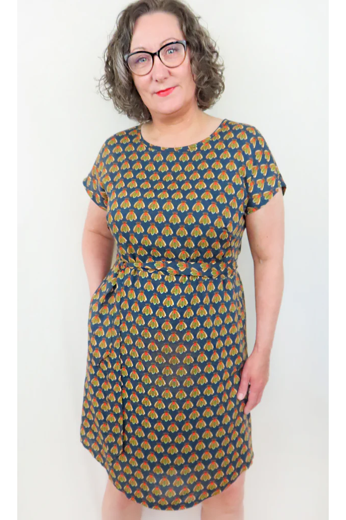 Beatrice Shift Dress by Mandala, Fly Navy, round neck short sleeves, French darts, elastic at back of waist, tie belt, keyhole cutout at back of neck, pull-on, scooped knee-length hem, pockets, fully lined, sizes XS to XL, made in Ontario