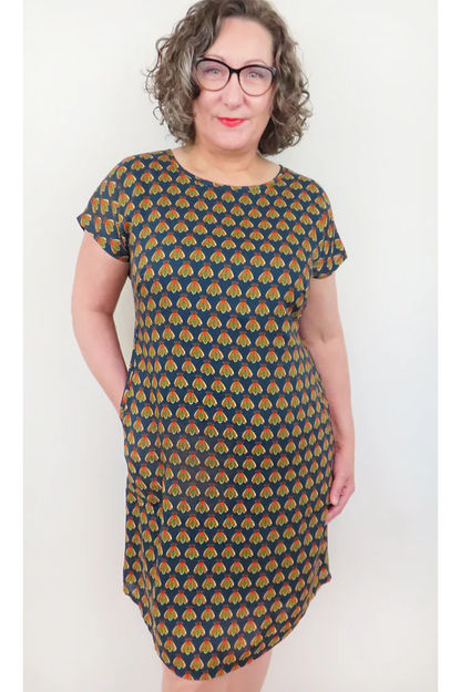 Beatrice Shift Dress by Mandala, Fly Navy, round neck short sleeves, French darts, elastic at back of waist, tie belt, keyhole cutout at back of neck, pull-on, scooped knee-length hem, pockets, fully lined, sizes XS to XL, made in Ontario