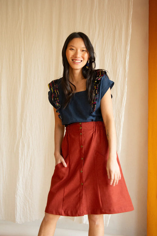 Chrysanthème Skirt by Kazak, Sashimi, knee-length, A-line, elastic at sides and back of waist, brass buttons up the front, two large pockets, eco-fabric, linen, rayon, sizes XS to XL, made in Montreal 