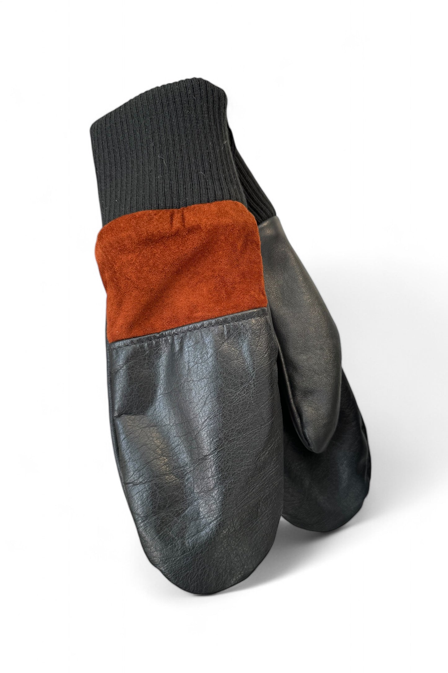 Lhasa Mittens by Kazak in Black and Fox, featuring recycled leather, ribbed knit cuffs, and fleece lining.