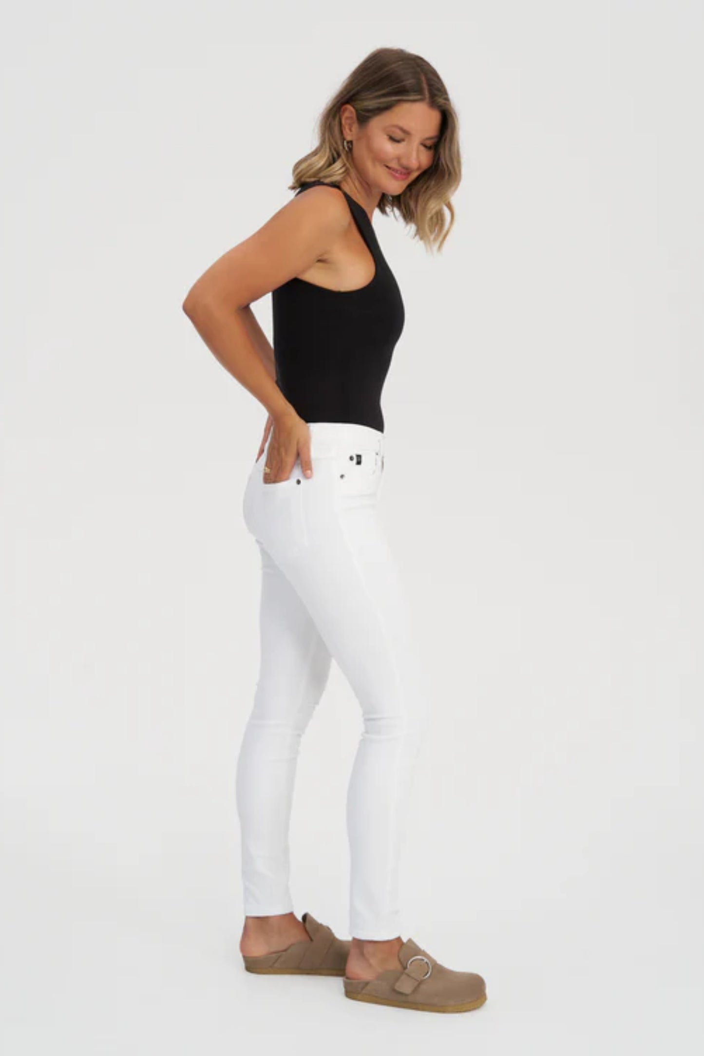 White RACHEL Mid Rise Skinny Yoga Jean, mid-rise, 30-inch inseam, faux front pocket, skinny fit, travel denim, eco-fabric, OEKO-TEX certified, Cotton USA certified, ISO 14001 certified, sizes 25-32, made in Canada