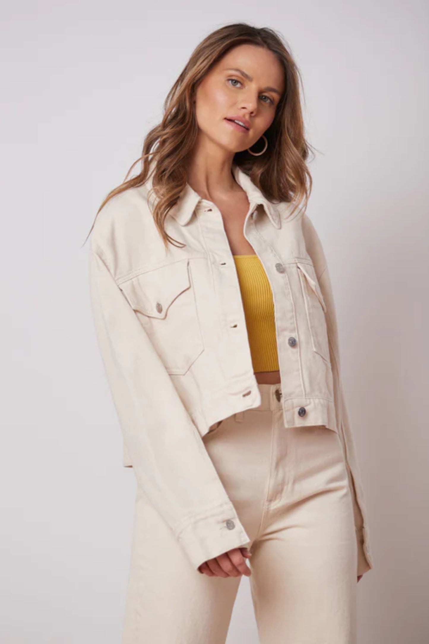 Oversized Off-White Denim Jacket by Yoga Jeans, oversized, cropped fit, button front, front pockets with buttons, 100% cotton, sizes XS to XL, made in Canada