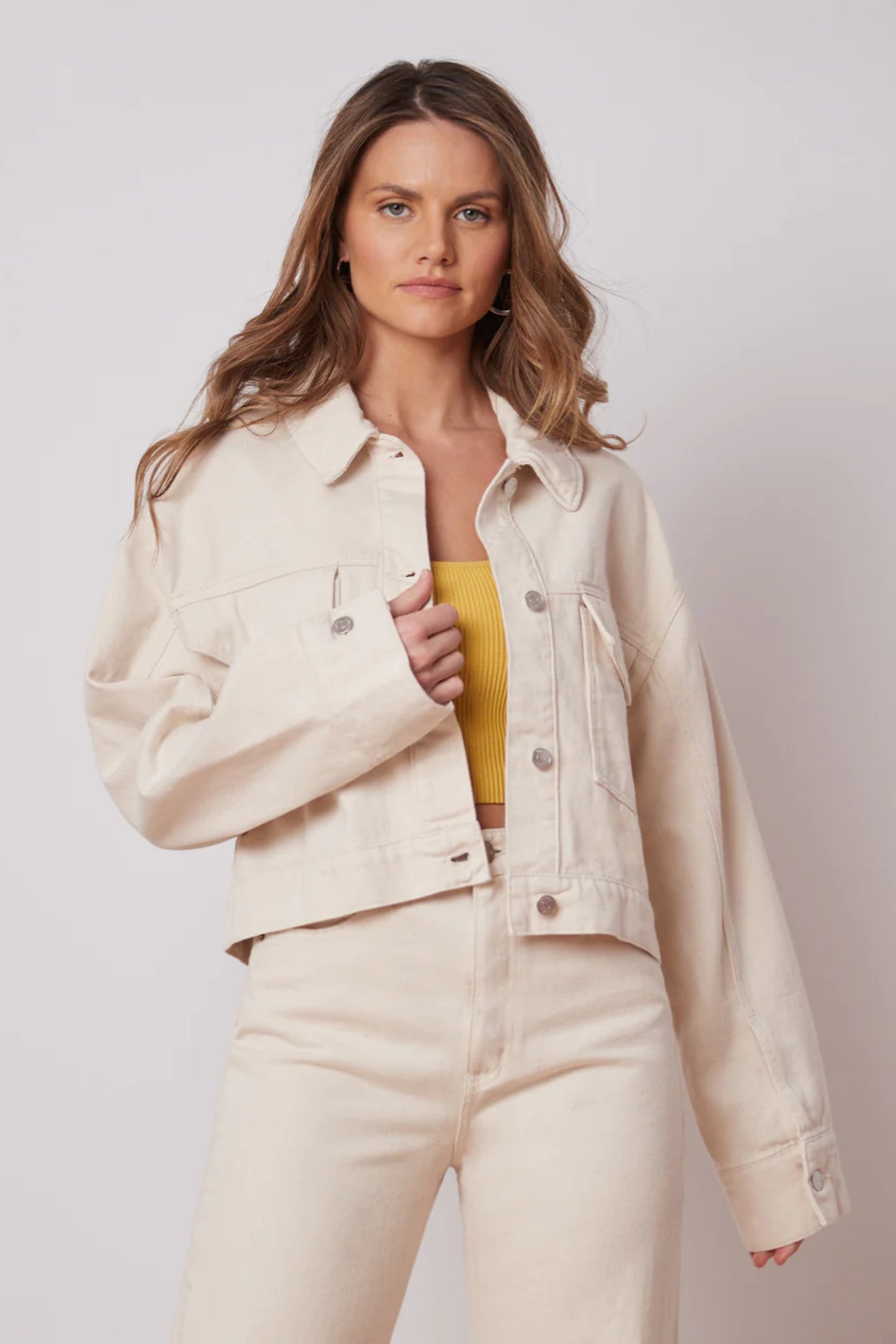 Oversized Off-White Denim Jacket by Yoga Jeans, oversized, cropped fit, button front, front pockets with buttons, 100% cotton, sizes XS to XL, made in Canada