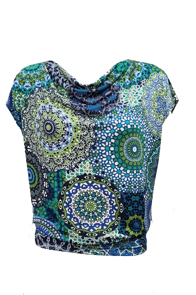 Mandala's Bowen Cowl Slouch Tee in Aqua Mandala print, featuring a cowl neck, short extended sleeves, and a blousy fit up top with a fitted waist, is show on a mannequin in front of a white background.