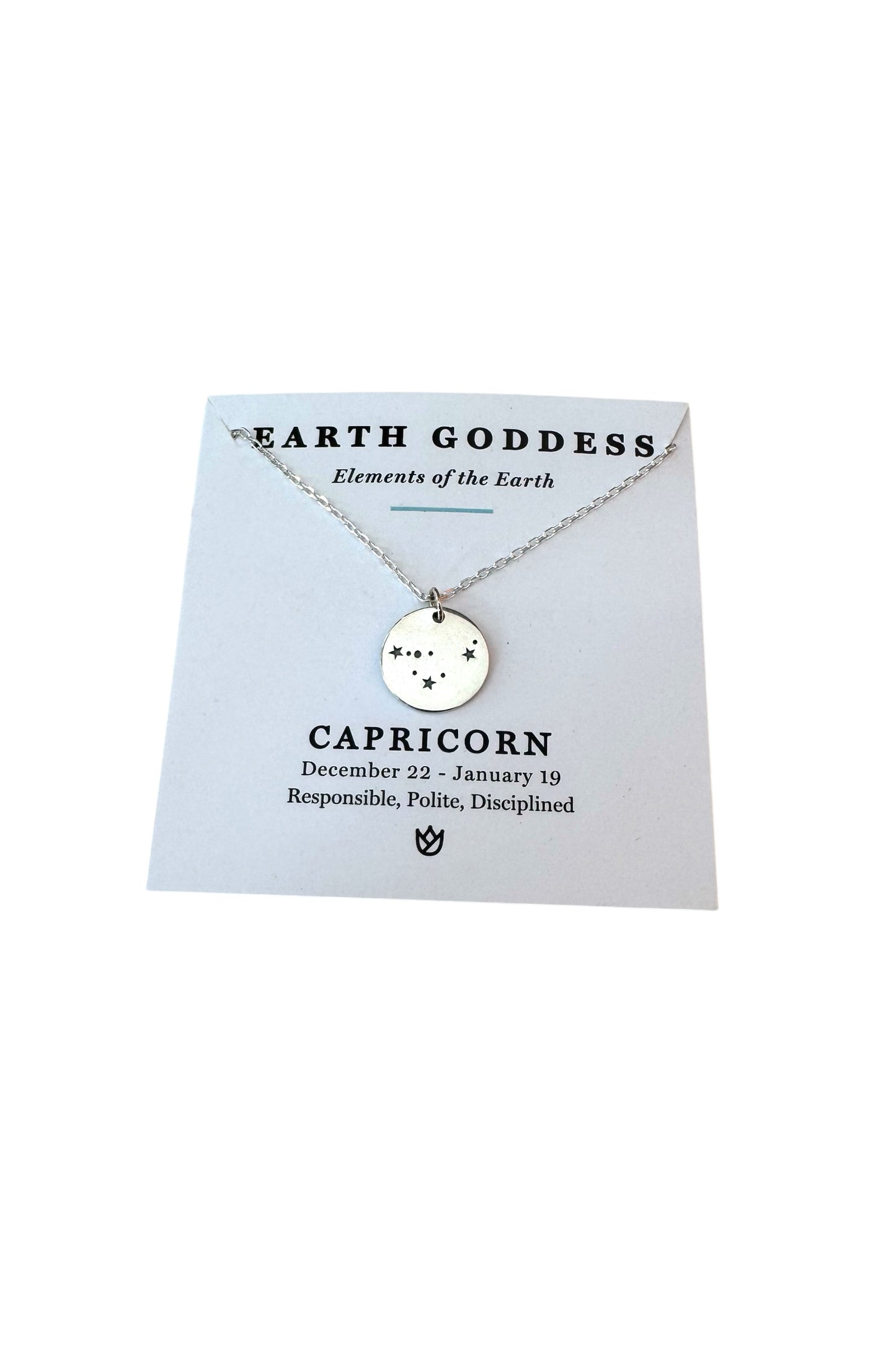 Necklace with Capricorn zodiac symbol on a 'Earth Goddess' branded card.