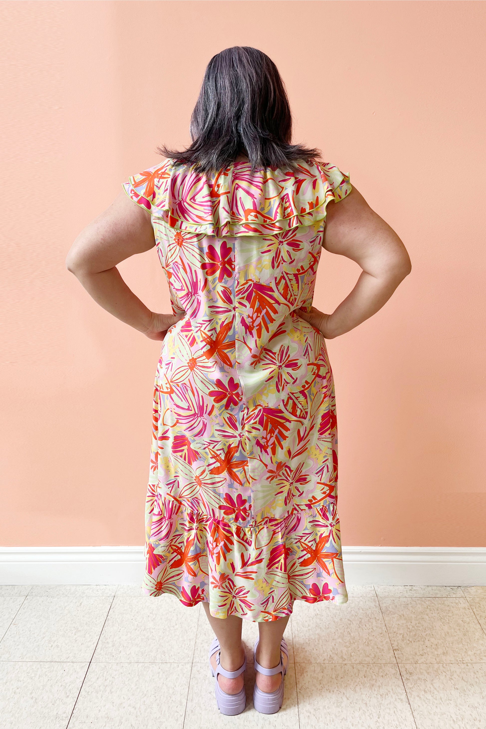 Cassandra Dress by Pure Essence, Floral, back view, double ruffle across neck and shoulders, tiered skirt, loose fit, midi-length, sizes XS to XXL, made in Canada