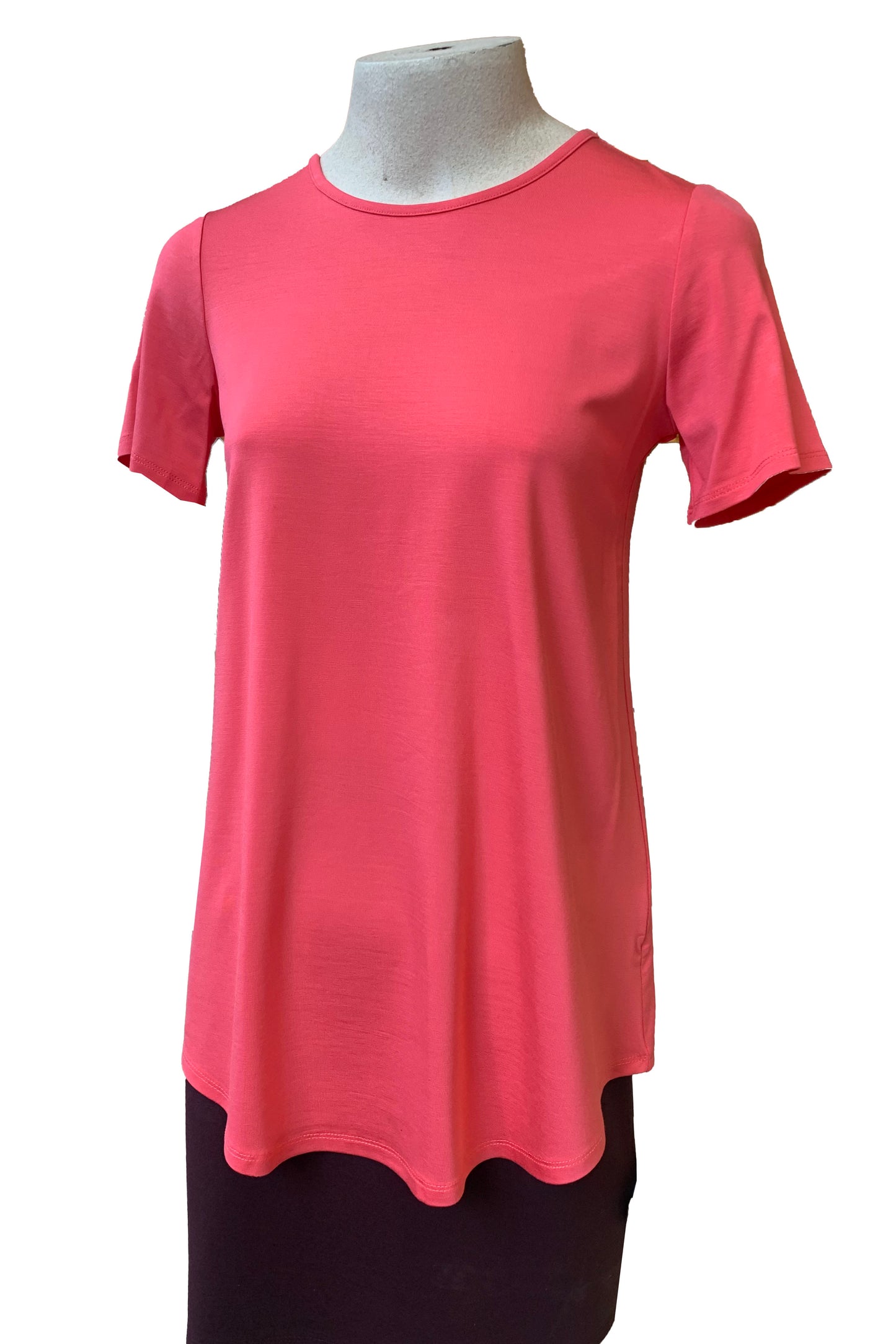 The Catherine Tee by Pure Essence in Coral is shown on a mannequin against a white background