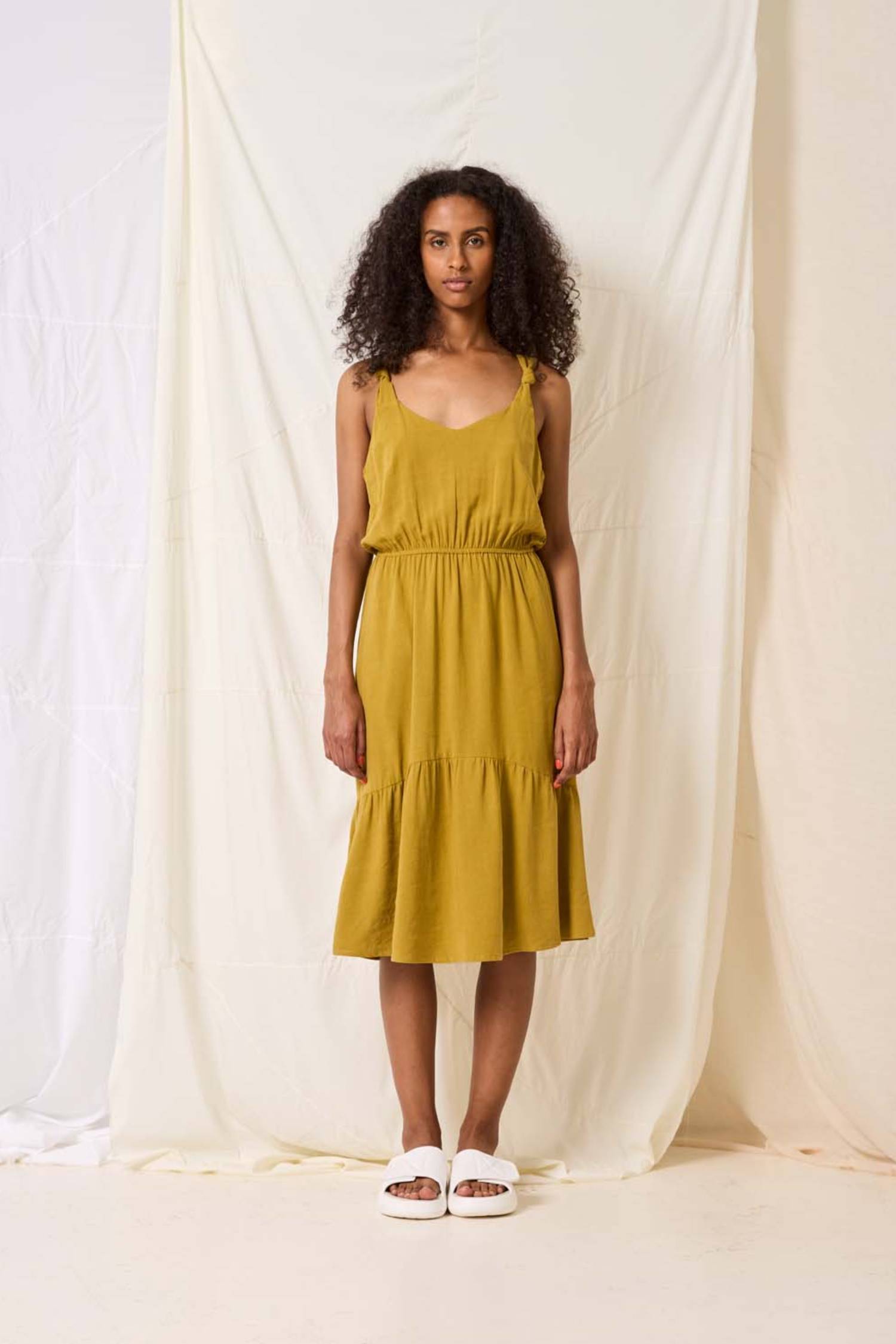 Rubia Dress by Cokluch, Pistachio, tank dress, knotted straps, rounded V-neck, elastic waist, midi-length, ruffled hem, viscose/linen, sizes XS to XL, made in Montreal