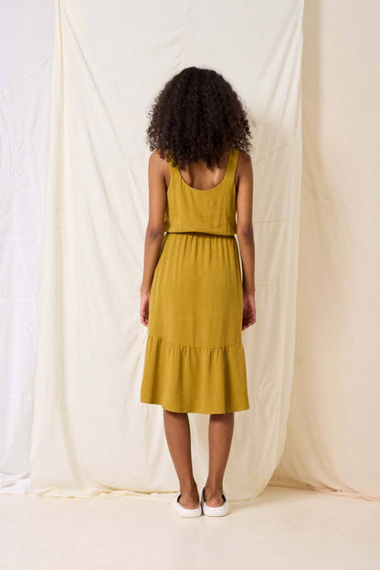 Rubia Dress by Cokluch, Pistachio, back view, tank dress, knotted straps, rounded V-neck, elastic waist, midi-length, ruffled hem, viscose/linen, sizes XS to XL, made in Montreal