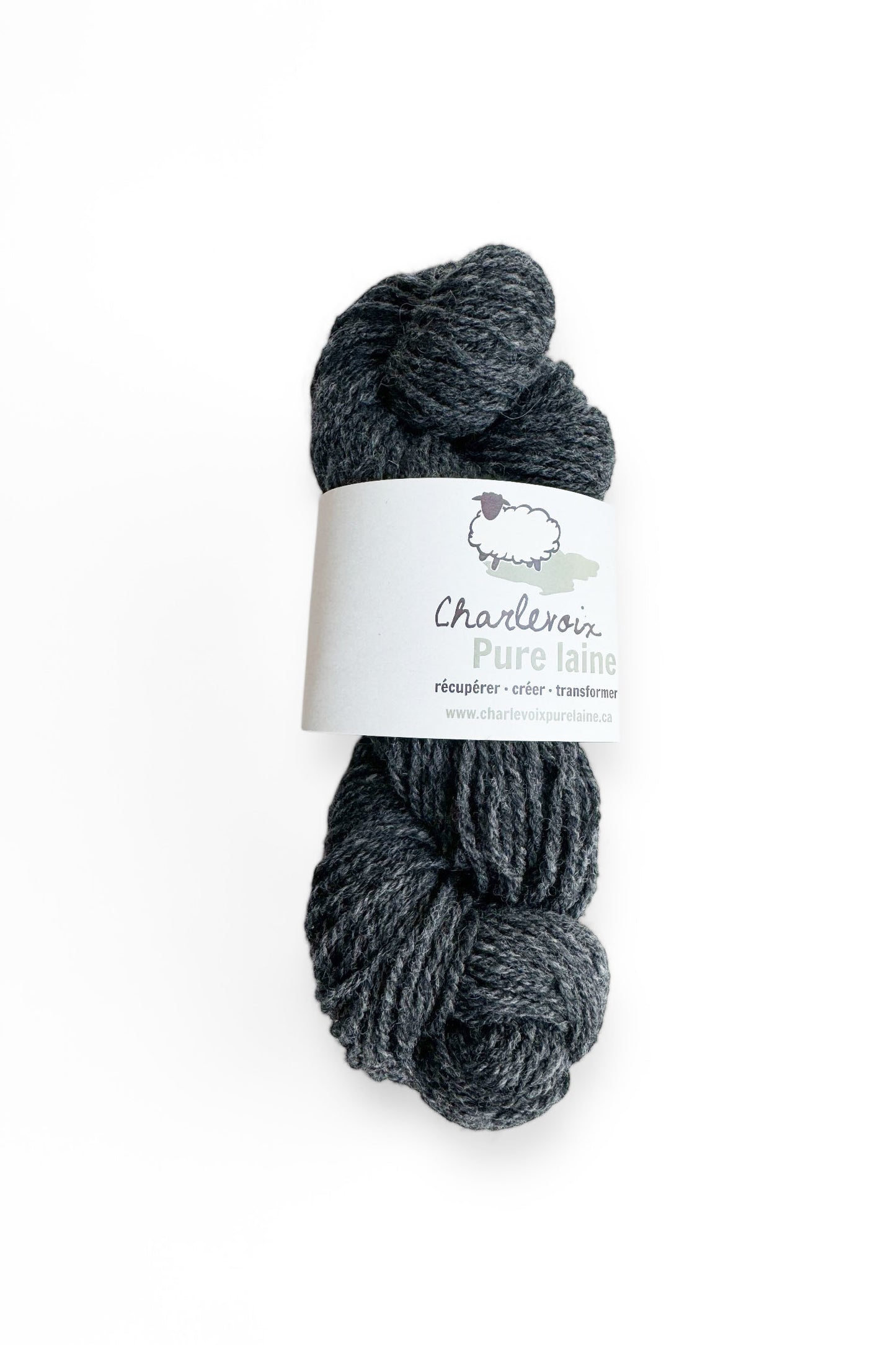 A skein of Charcoal yarn from Charlevoix Pure Laine is shown against a white background