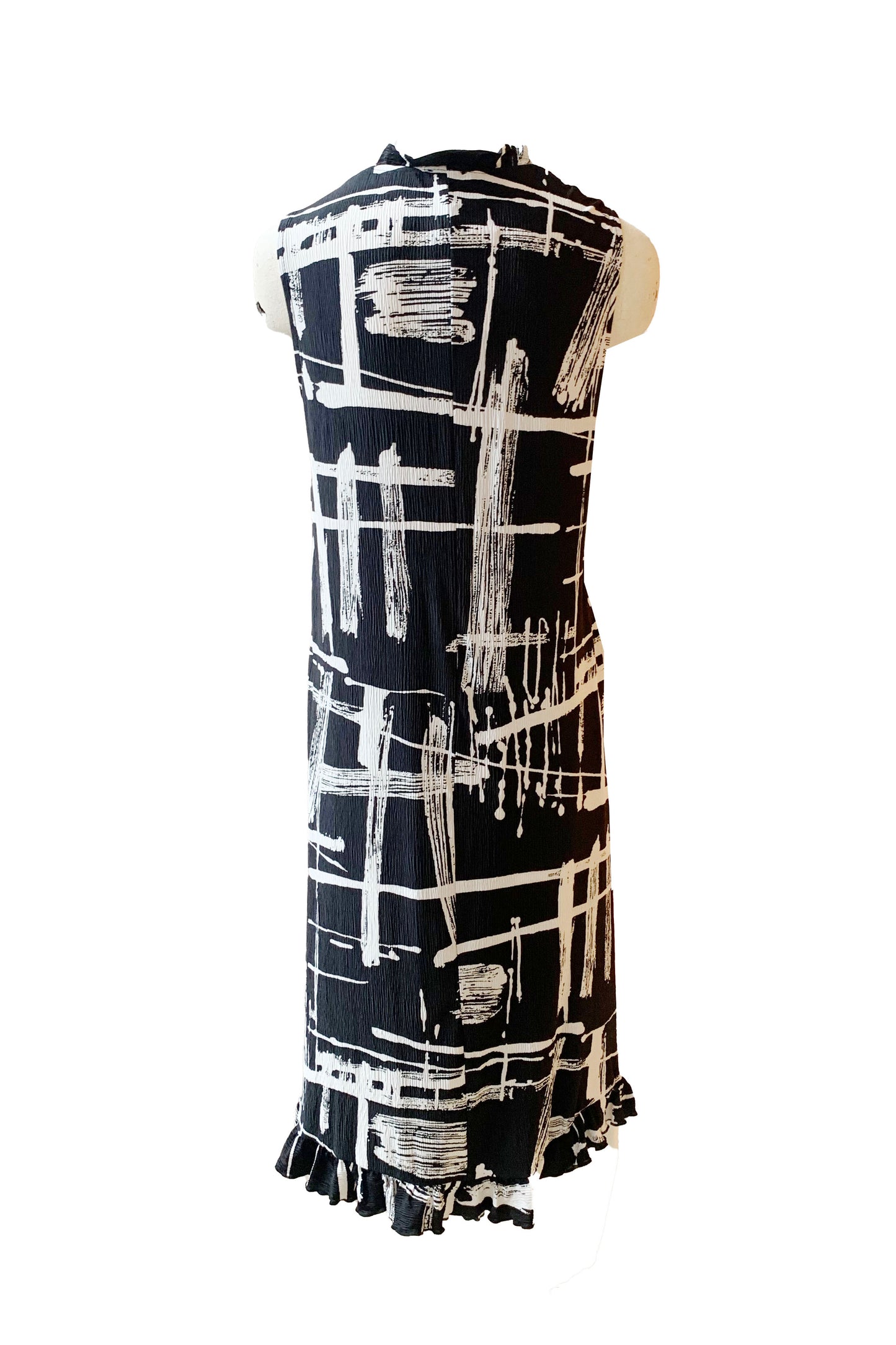 A back view of the Cordelia Dress by Pure Essence in Black/White Print is shown on a mannequin in front of a white background