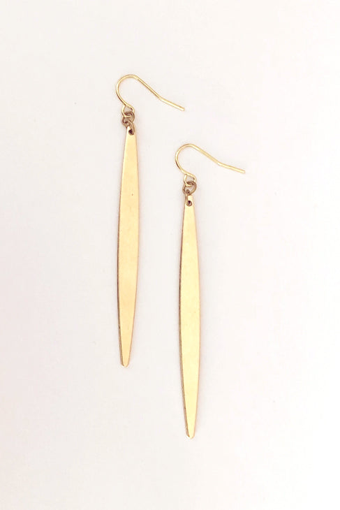 Luttu earrings by Darlings of Denmark; slim, spear-shaped; raw brass; dangle earrings; flat lay