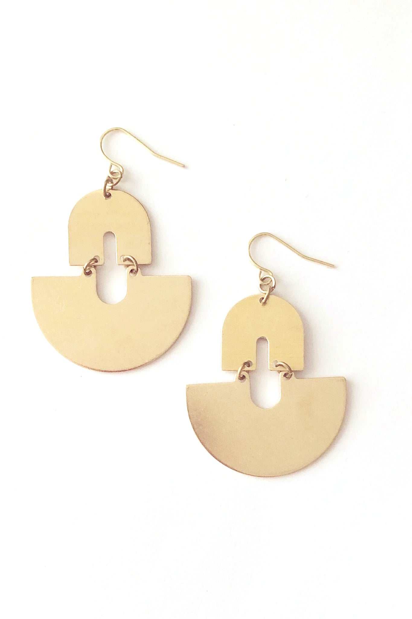 Suge earrings by Darlings of Denmark; graphic, raw brass, dangle earrings; flat lay