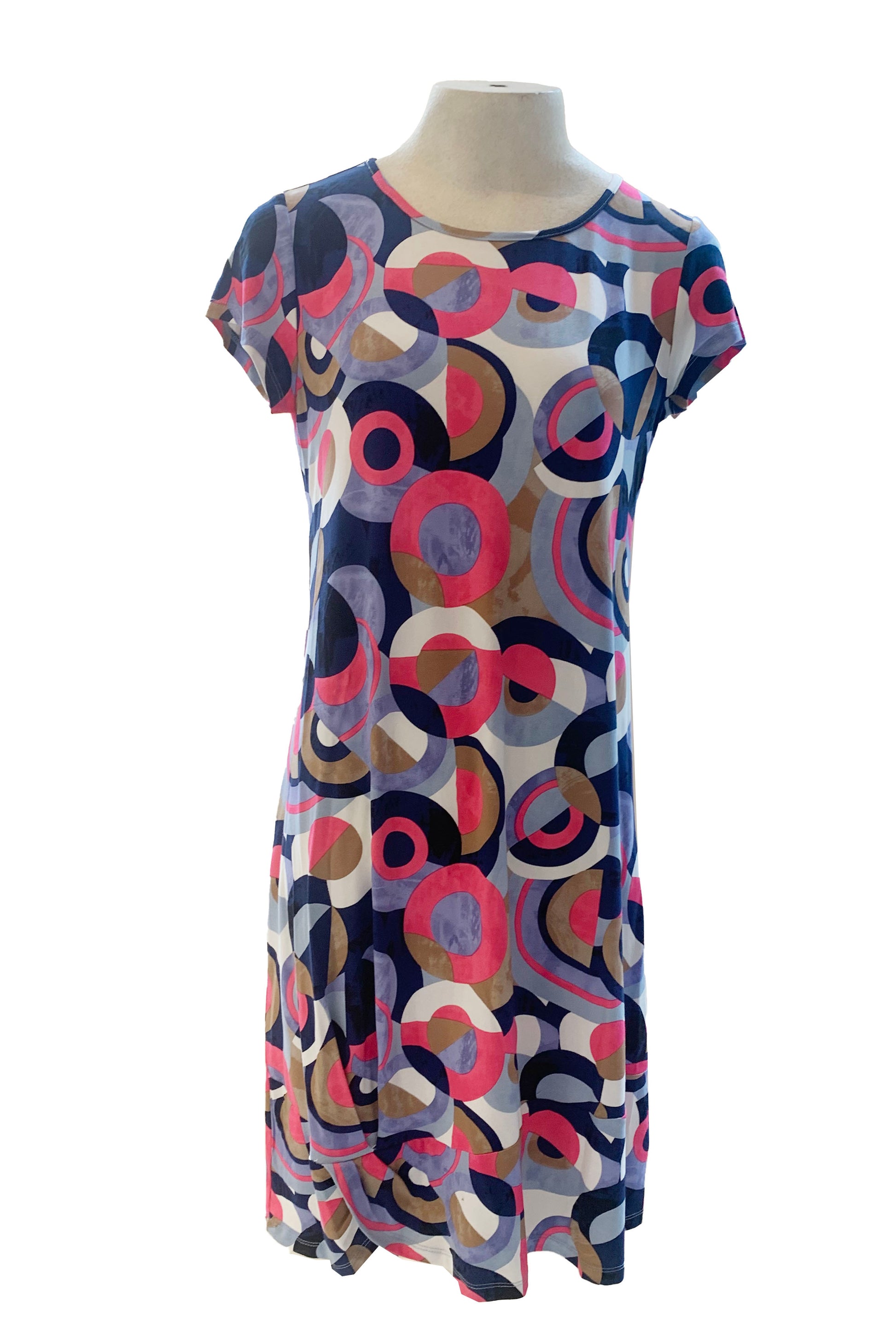 The Chantal Dress by Pure Essence in a Pink/Navy circles pattern is show on a mannequin in front of a white background 