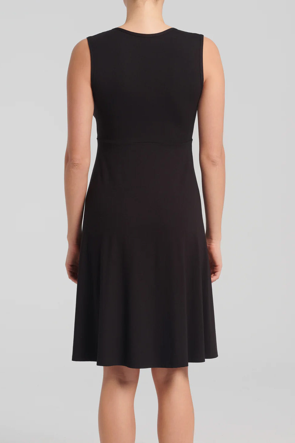 Ayesha Dress by Kollontai, Black, back view, wrap-over neckline, wide straps, empire waist, loose fit through the bodice, knee-length, pill-resistant viscose, sizes XS-XXL, made in Quebec