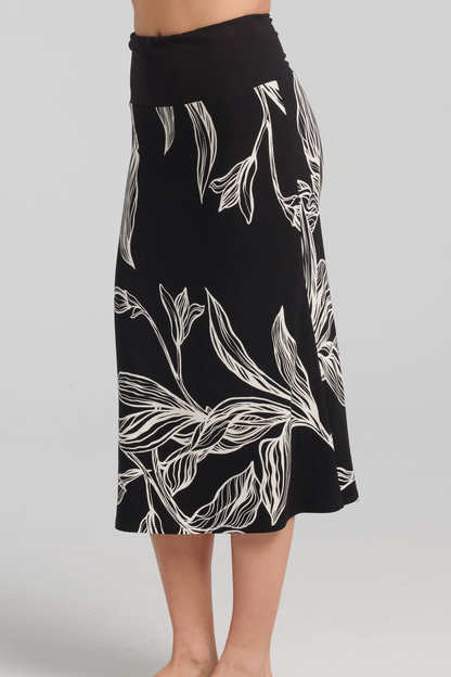 Ostara Skirt by Kollontai, Black and white leaf print, solid black pull-on waistband, mid-calf length, slight A-line shape, sizes XS to XXL, made in Montreal 