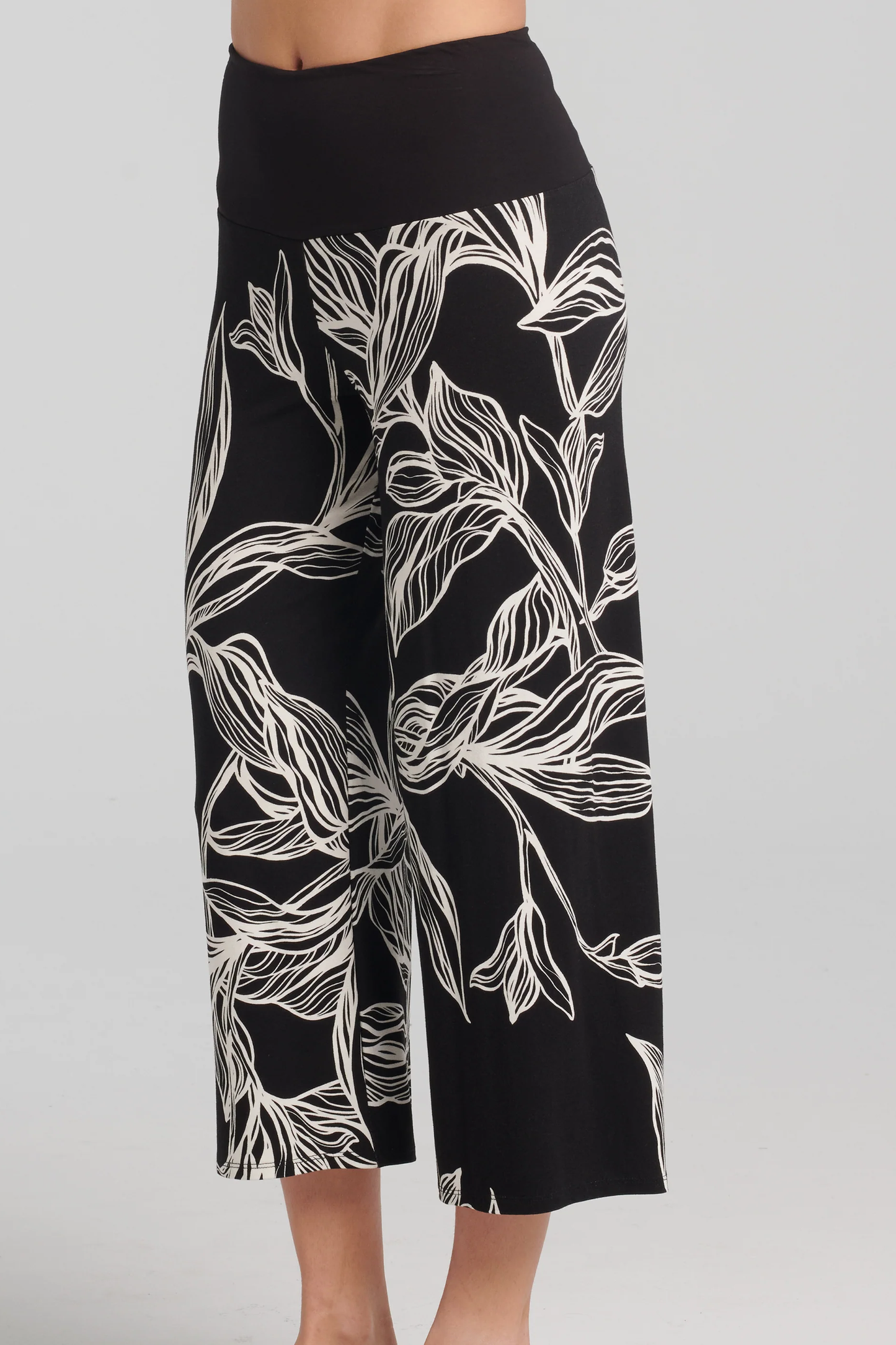 Thora Pants by Kollontai, Black and white leaf print, solid black pull-on waistband, wide legs, slightly cropped, sizes XS to XXL, made in Montreal