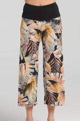 Selket Pants by Kollontai, neutral tropical print on legs, wide pull-on black waistband, wide legs, cropped length, sizes XS to XXL, made in Quebec