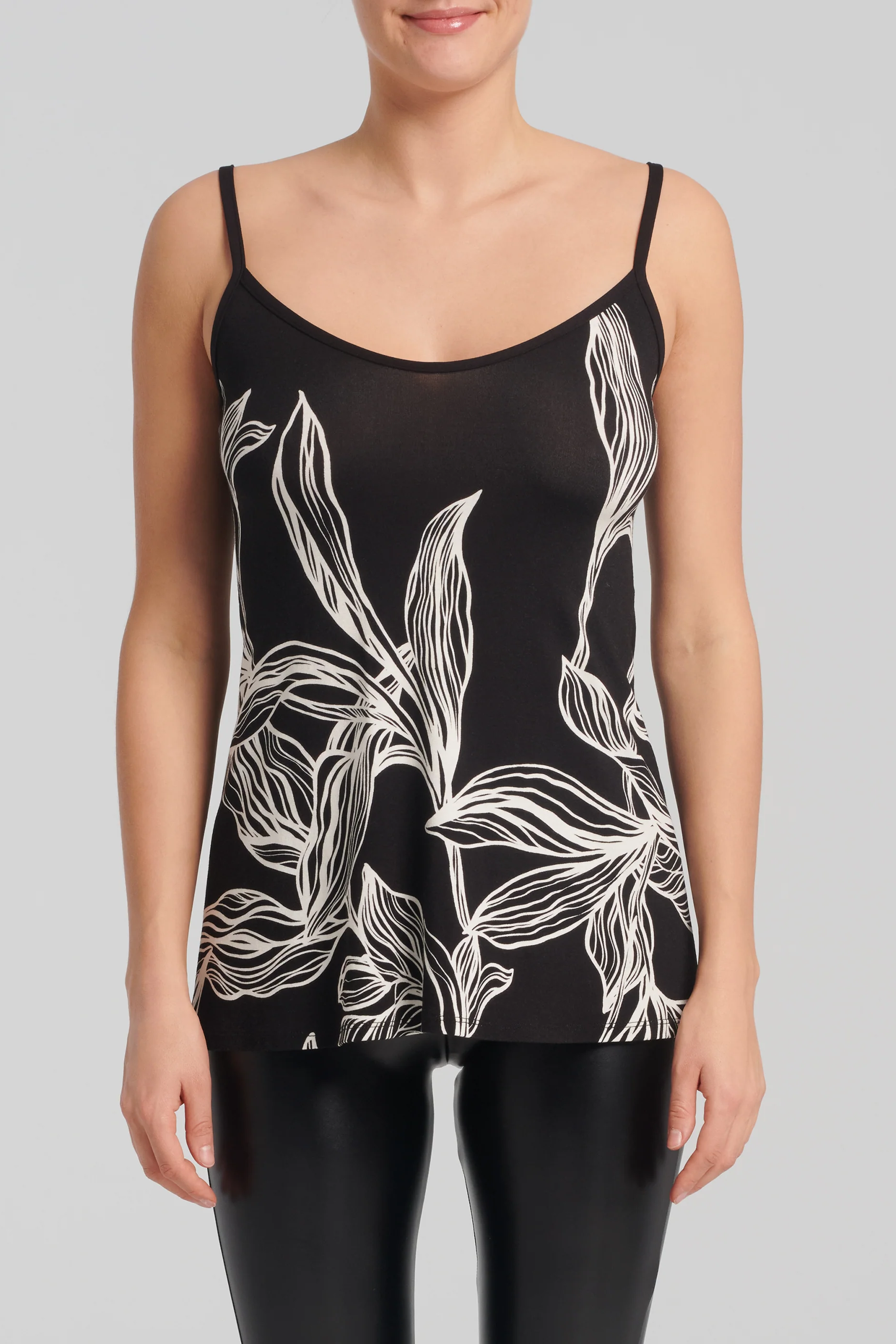 Zaria Top by Kollontai, Black and white leaf print on the front, solid black on the back, spaghetti straps, hip-length, slightly loose fit, sizes XS to XXL, made in Montreal