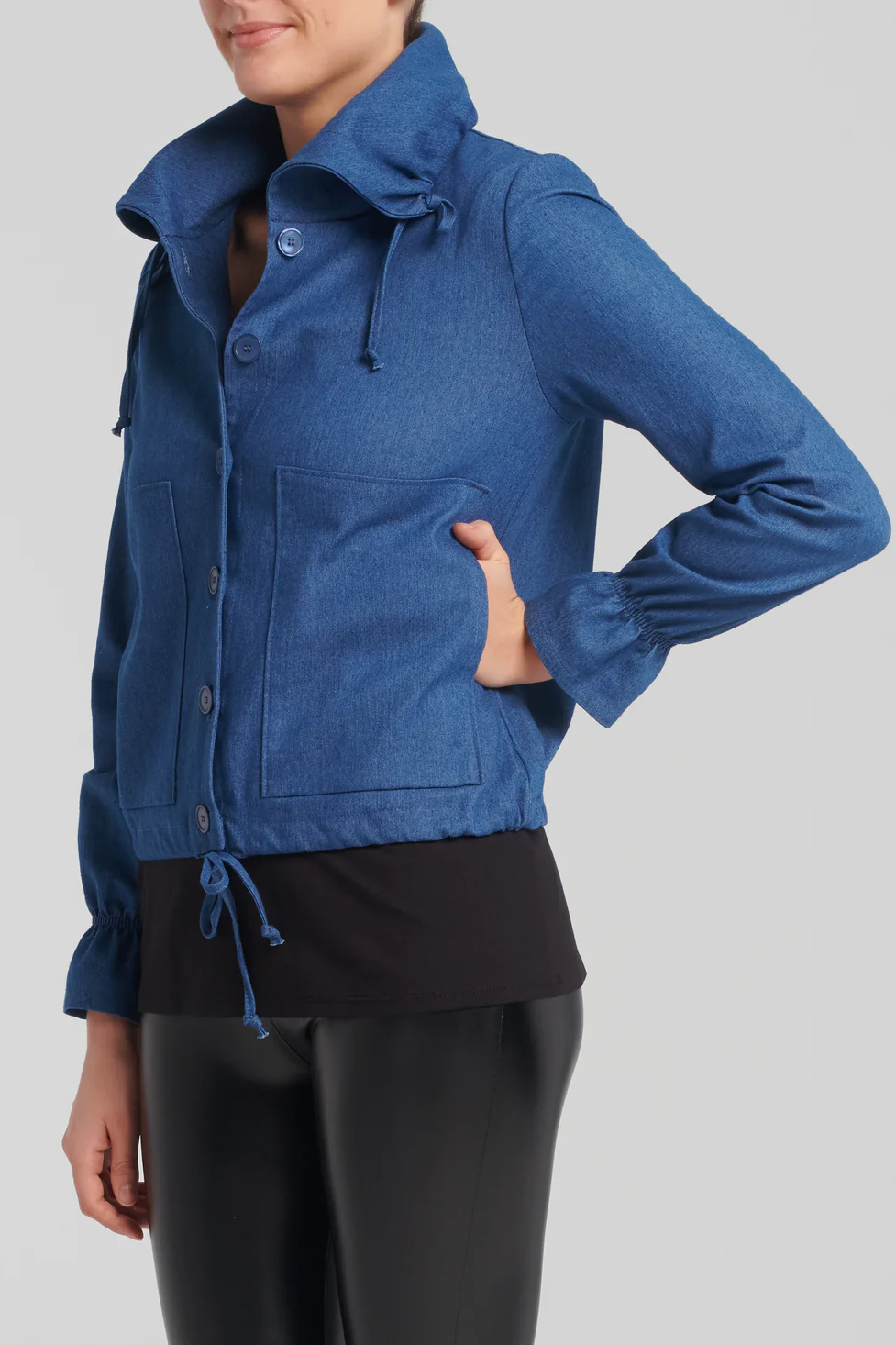 Eudora Jacket by Kollontai, Blue, side view, large collar with draw strings, drawstring at the hem, front buttons, large patch pockets, puff detail at the cuffs, sizes XS to XXL, made in Montreal 