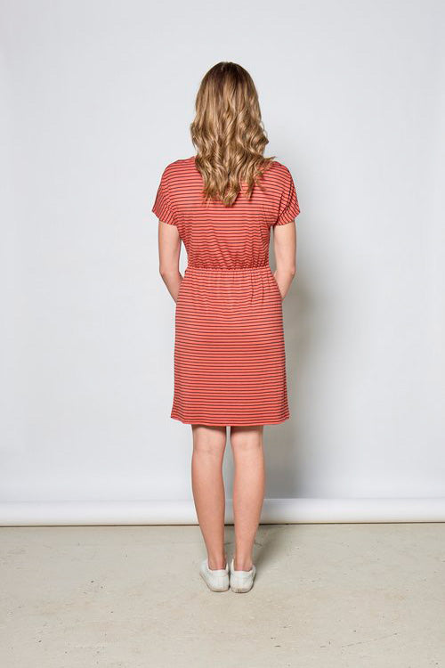 Joelle Dress by Tangente, Coral/Black stripes, back view, cap sleeves, round neck, pleats and built-in tie at waist, elastic at the back of the waist, above the knee length, eco-fabric, bamboo rayon, sizes XS to XXL, made in Ottawa 