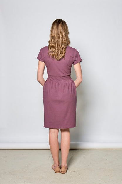 Thea Dress by Tangente, Violet, back view, cross-over neckline, wide waistband, gathered skirt with inseam pockets, short dolman sleeves, above the knee length, eco-fabric, bamboo rayon, sizes XS to XXL, made in Ottawa