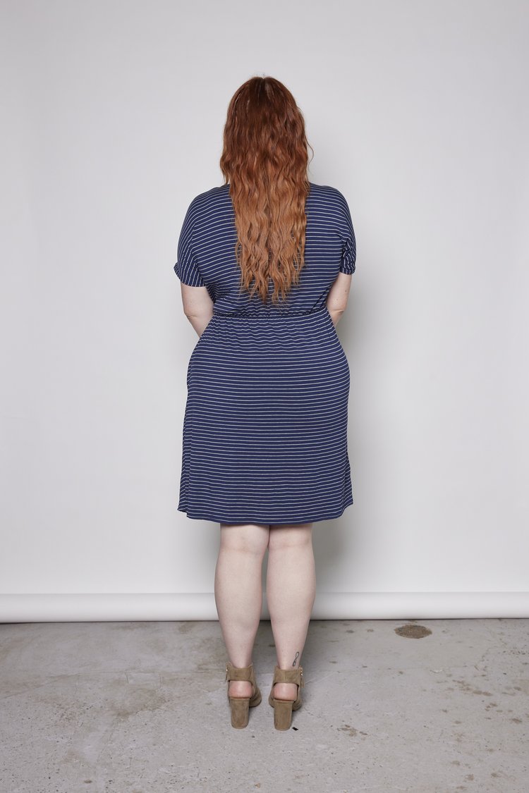 Hazel Dress by Tangente, Navy with Grey Stripe, back view, cap sleeves, pleating at the waist, elastic at back waist, attached ties at waist, bamboo rayon, sizes XS to XXL, made in Ottawa