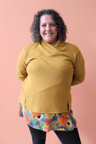 Karen Sweater by Solomia Design, Ocher, cross-over neckline, asymmetrical front panels, slits at the bottom, rib knit, sizes XS to L, made in Carleton Place