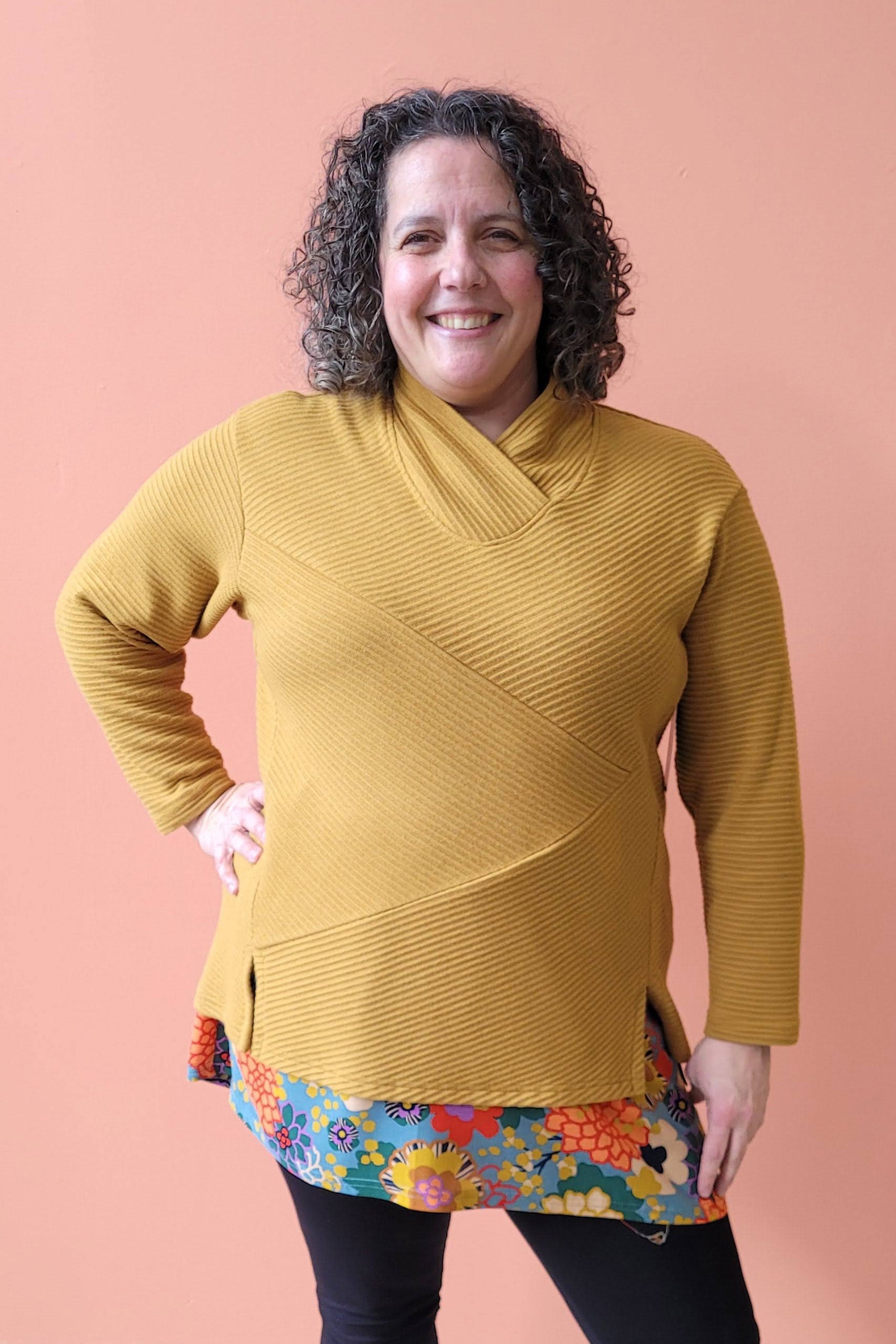 Karen Sweater by Solomia Design, Ocher, cross-over neckline, asymmetrical front panels, slits at the bottom, rib knit, sizes XS to L, made in Carleton Place