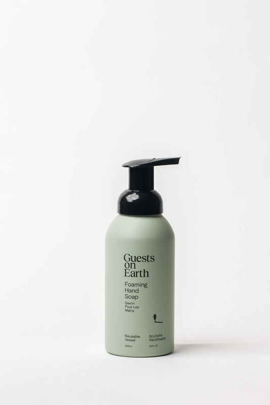 
Bottle of Guests on Earth foaming hand wash in Citrus Oasis scent shown against a white background. 