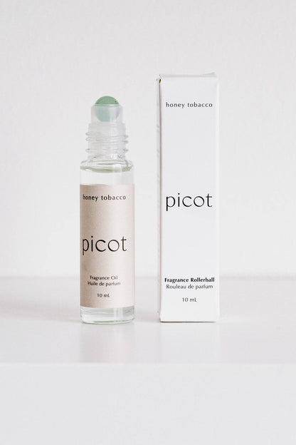 Picot honey tobacco fragrance rollerball in Green Aventurine stone with packaging on a white background