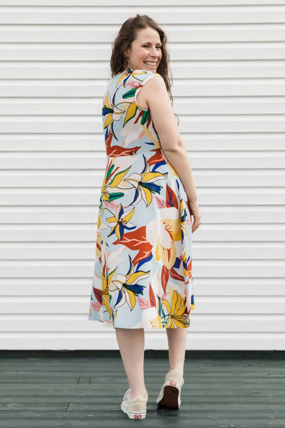 Riley Dress by Copious, Blue/Yellow floral, back view, round neck, cap sleeves, A-line shape, cinched empire waist, tea length, eco-fabric, cotton and linen, sizes XS to L, made in Ottawa