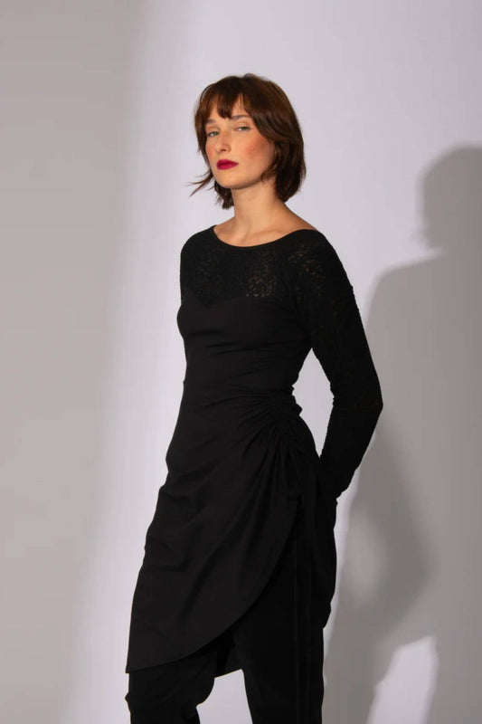 A woman wearing the Petals Reversible Dress by Eve Lavoie in Black, featuring a sweetheart neckline neck line and a drawstring on one side 