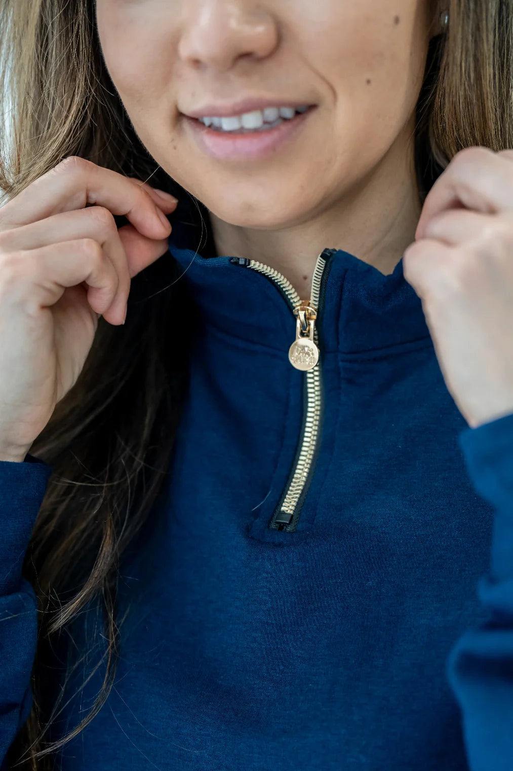 Gold zipper detail of the 3/4 Zip Pullover by Olive+Splash in Navy.