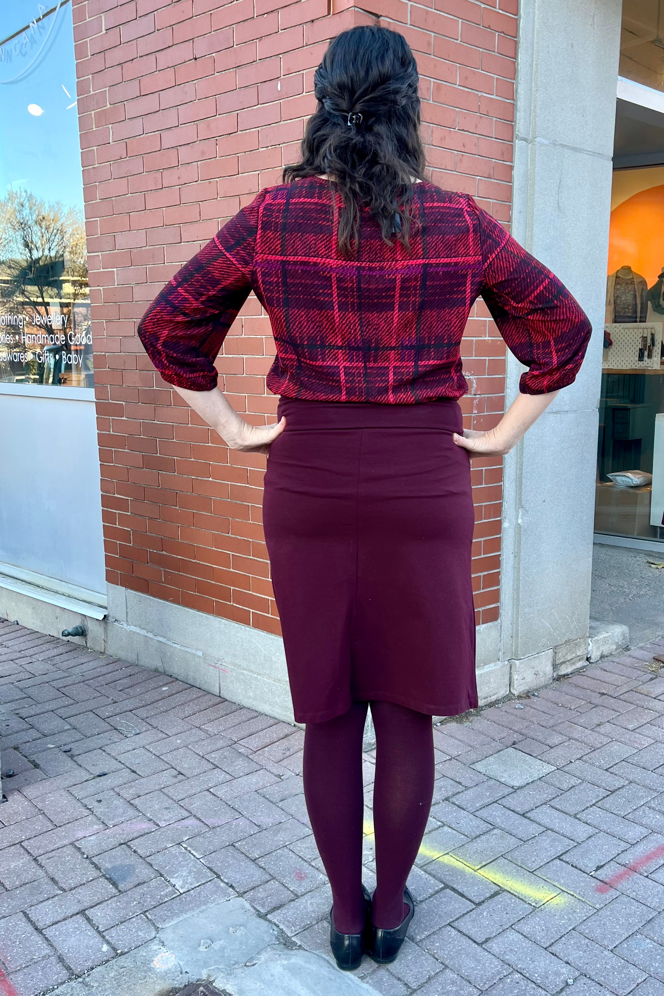 Solo Plaid Blouse by Mandala, Red, back view, wide neck, 3/4 sleeves with gathered cuff and covered button detail, back yoke, french darts, rounded hem, loose fit, sizes XS to L, made in Ontario
