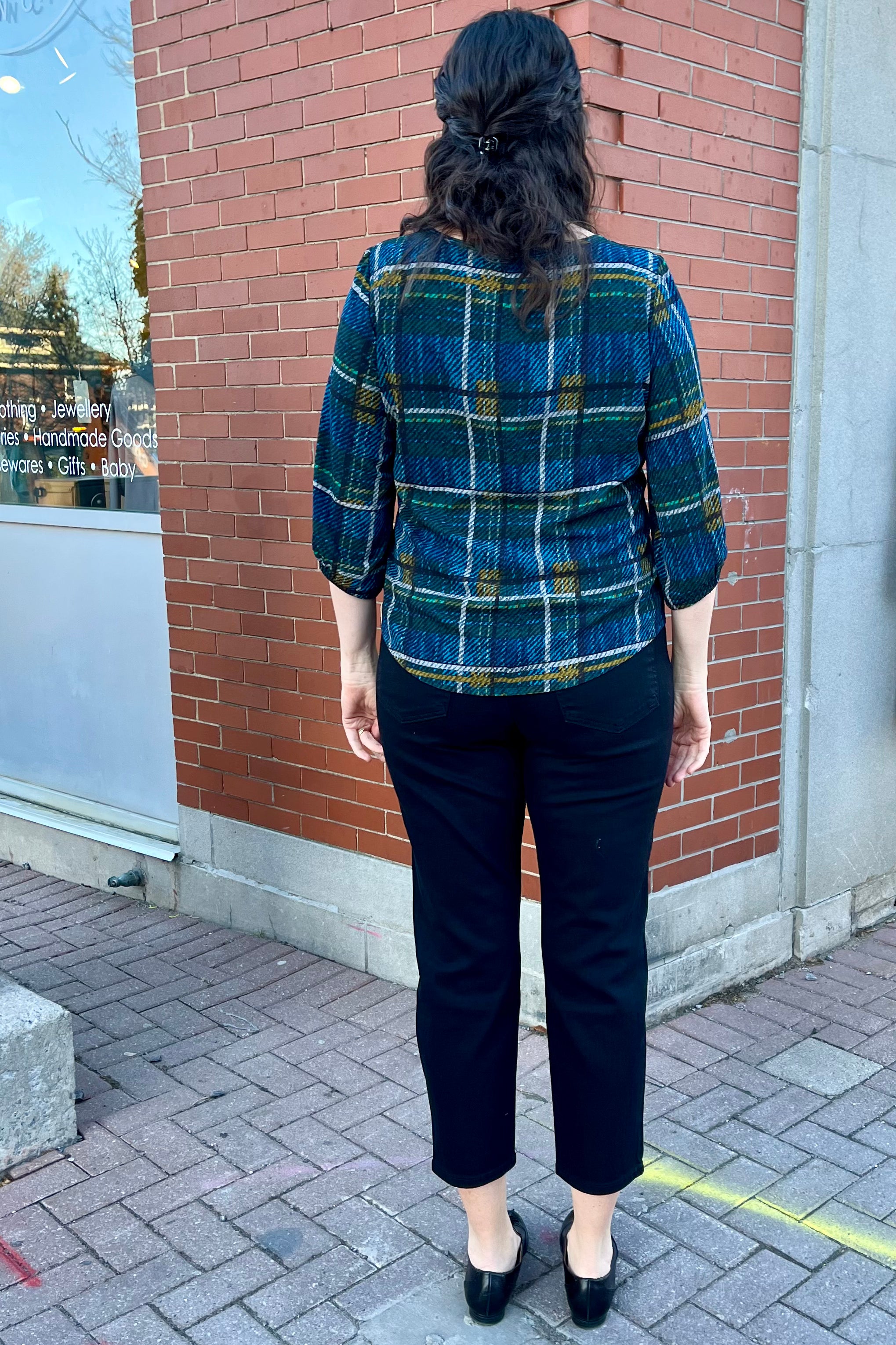 Solo Plaid Blouse by Mandala, Blue, back view, wide neck, 3/4 sleeves with gathered cuff and covered button detail, back yoke, french darts, rounded hem, loose fit, sizes XS to L, made in Ontario