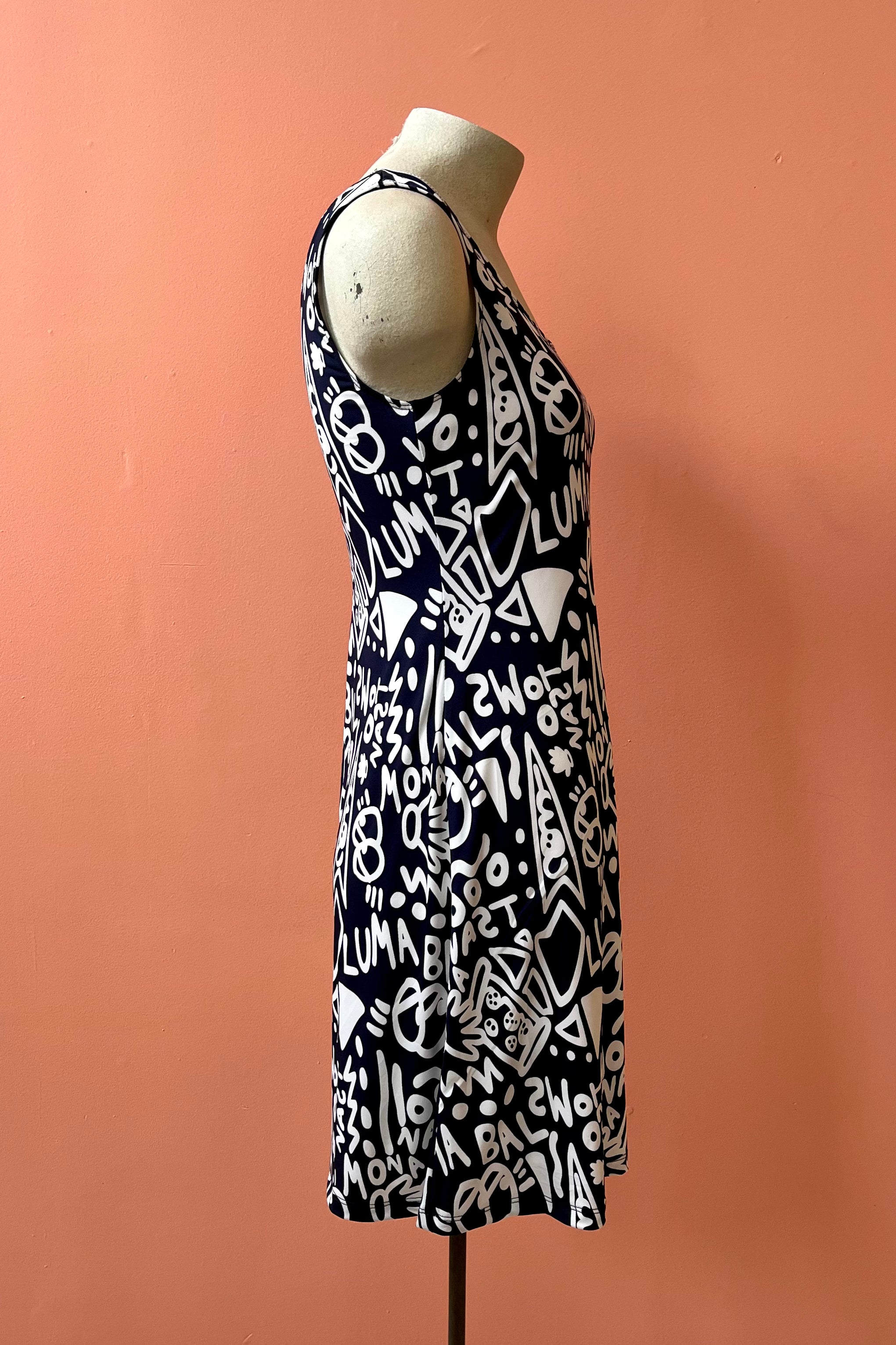 Phillips Dress by Yul Voy, black and white graffiti print, side view, scooped neck front and back, tank dress, wide straps, fit and flare shape, above the knee, sizes XS to XXL, made in Montreal