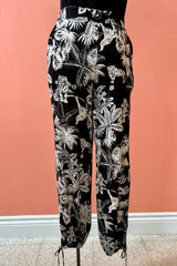 Best Pant by Yul Voy, back view, black and white jungle print, loose fit, elastic waist, cut-out with tie detail at ankles, sizes XS-XXL, made in Montreal