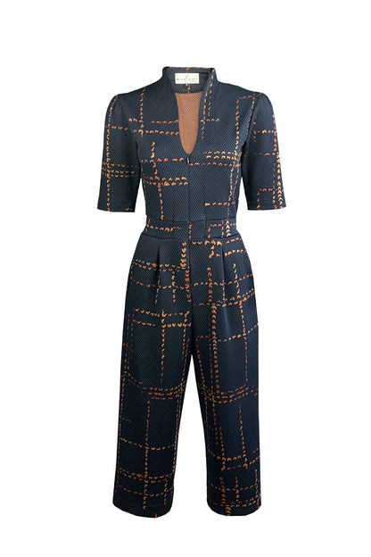 The Jonathan Jumpsuit by Melow in Indigo is shown in front of a white background