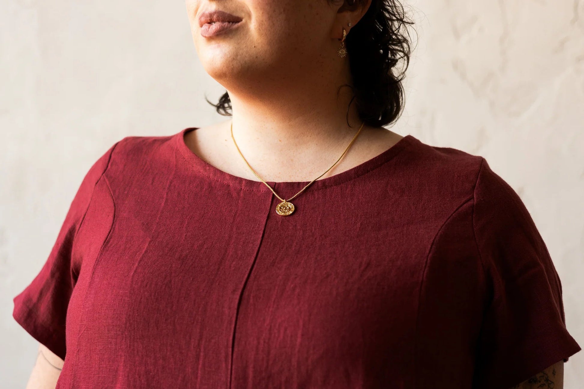 Detail of the top of the Astoria Dress by Lights of All in Garnet