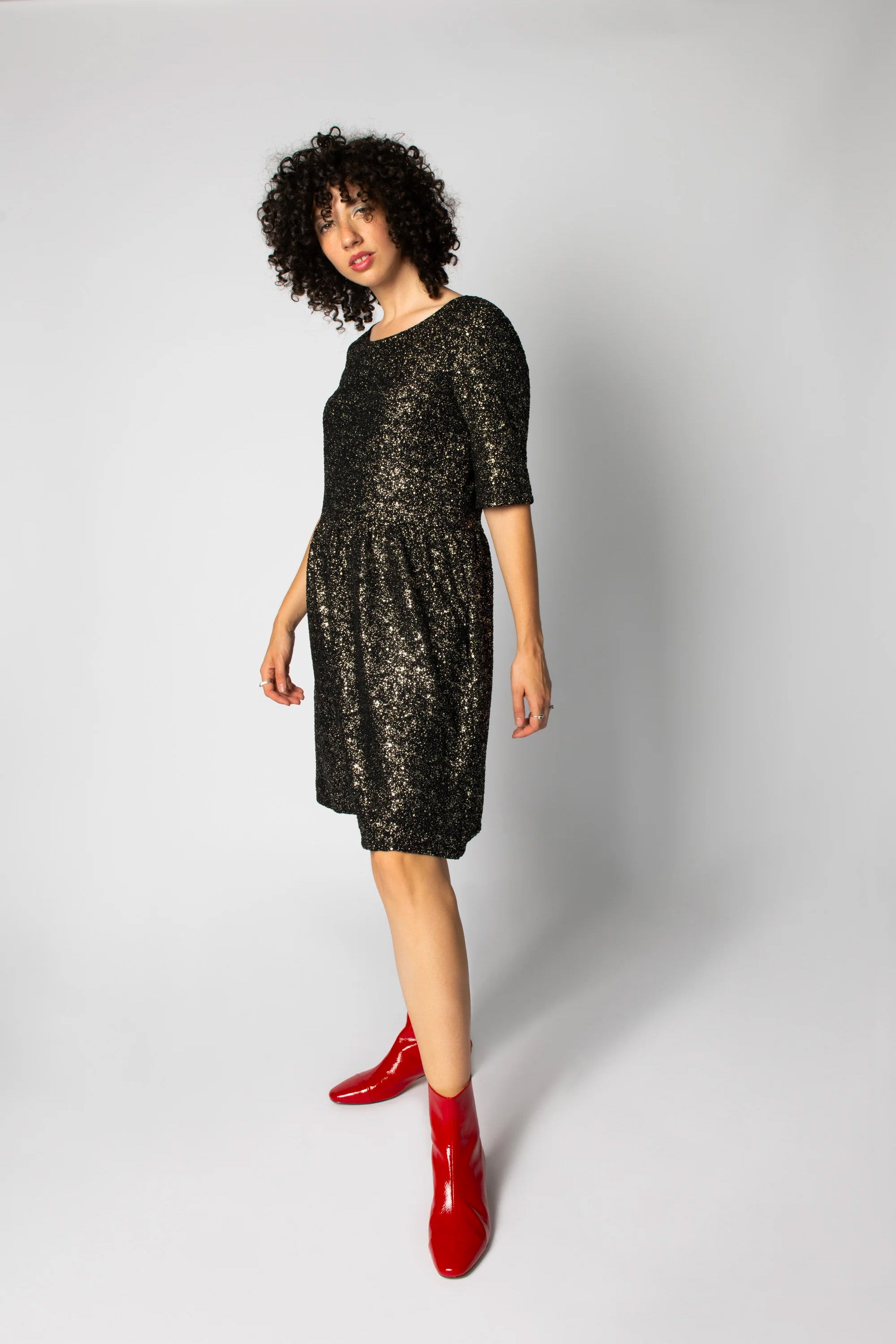 Lousse Dress by Eve Lavoie, Glitter Fabric, reversible, boat neck on one side, V-neck at the other, defined waist, full skirt, elbow-length sleeves, sizes XS to XL, made in Montreal 