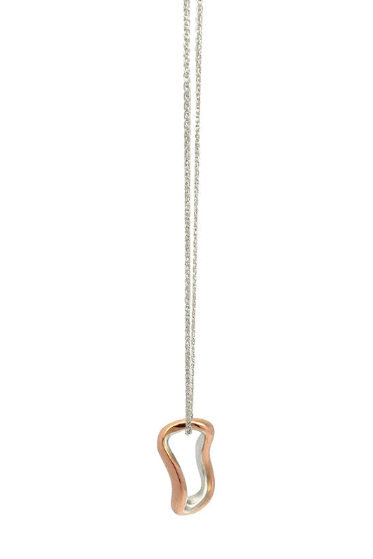 Copper and silver necklace with a unique pendant on a white background