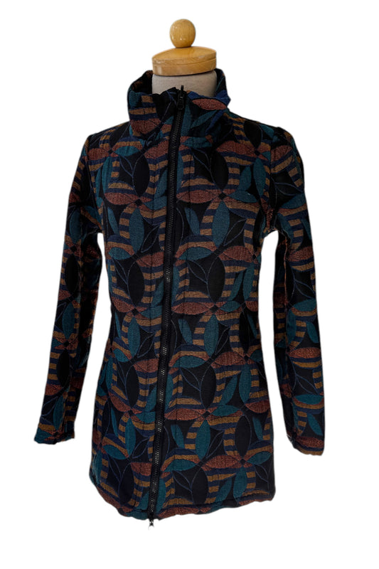 The 3/4 Reversible Jacket Mosaic Flowers by Veronique d'Aragon in Blue, with a high collar and a zip front, is shown on a mannequin against a white background.