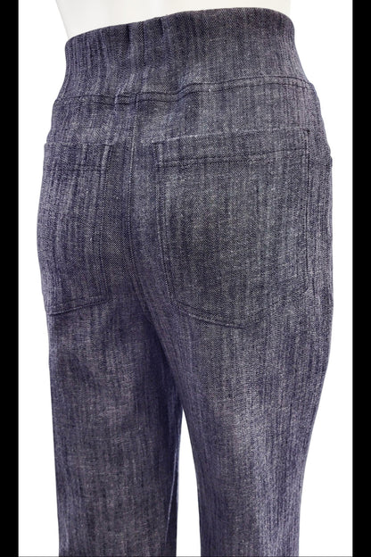 Close up back view of the The Wade Vintage Denim Pants in Indigo by Mandala are shown on a mannequin against a white background.

