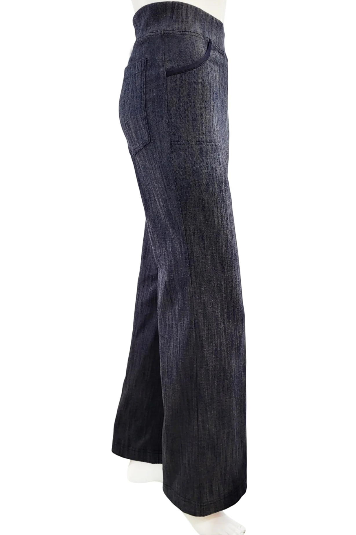 A side view of the Wade Vintage Denim Pants in Indigo by Mandala  shown on a mannequin against a white background. 